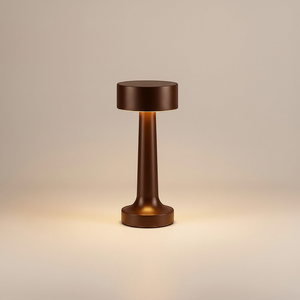 Lysverden cordless table lamp in brushed aluminum with disc top and 4 color temperatures. Touch control, 3-level dimming, and Qi charging.