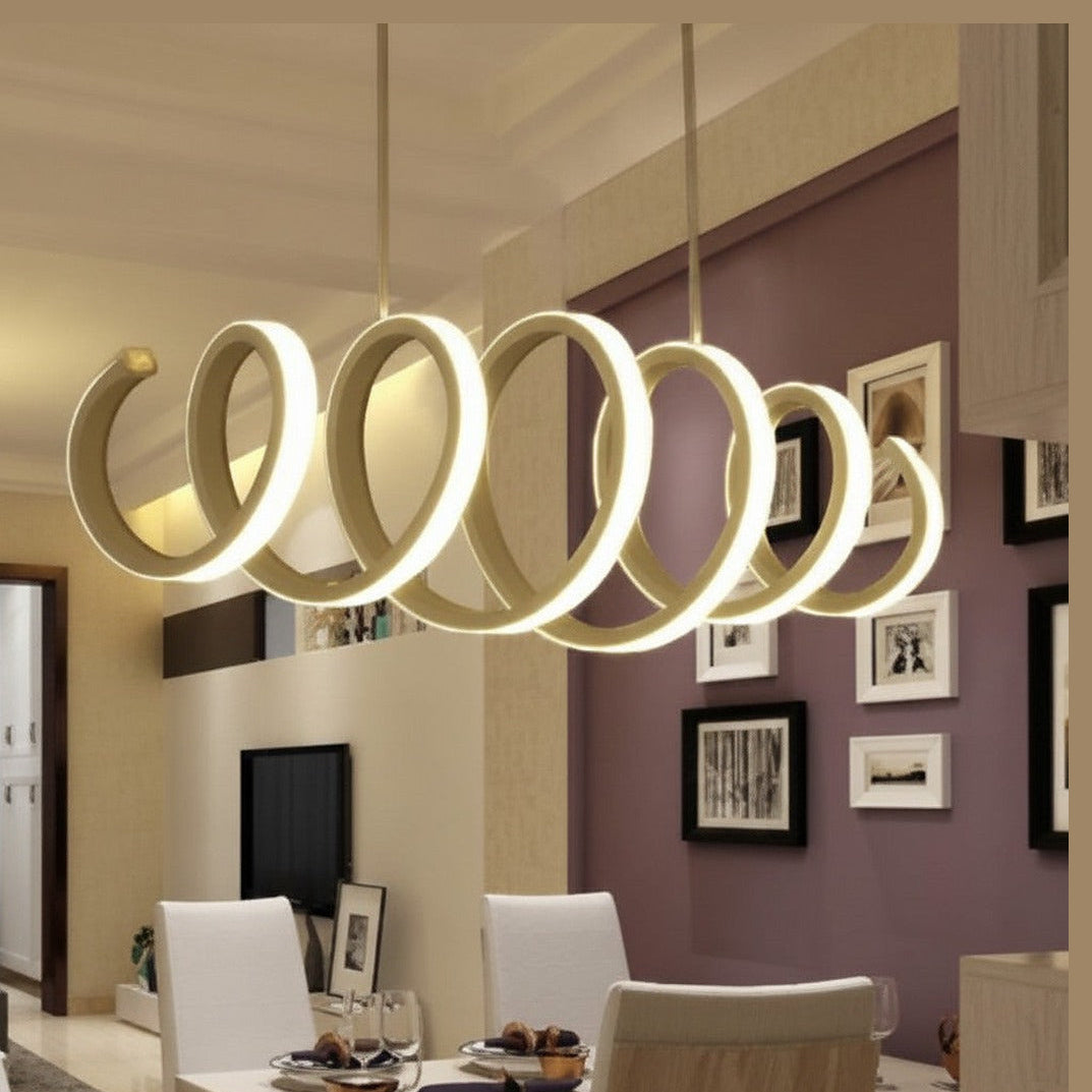 Lysverden modern white LED ring pendant light with a graphic spiral design hanging over a dining table.