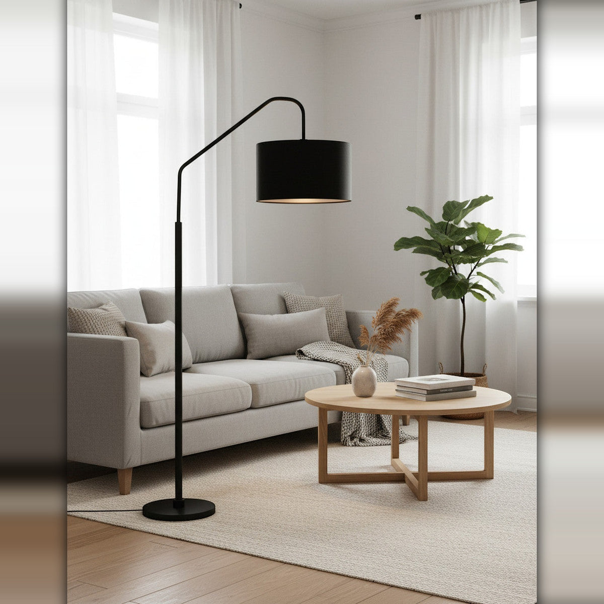 Lysverden black arched floor lamp with a fabric shade positioned over a grey sofa in a modern living room
