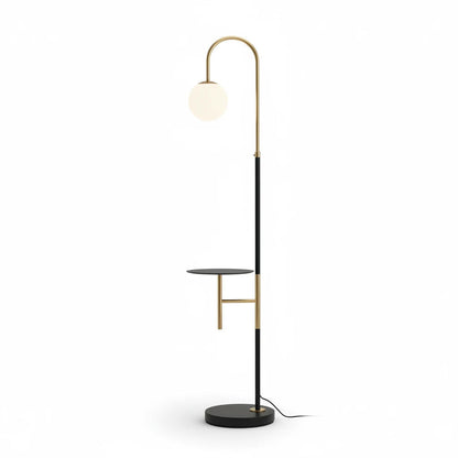 Lysverden modern arched floor lamp in black and gold with an opal glass globe shade and integrated side shelf.