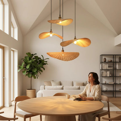 Lysverden handwoven rattan pendant lamps in an asymmetrical hat shape hanging over a dining table in a Japandi home.