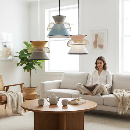 Lysverden bamboo pendant lights with double fabric shades in blue, yellow, and white hanging in a Japandi living room