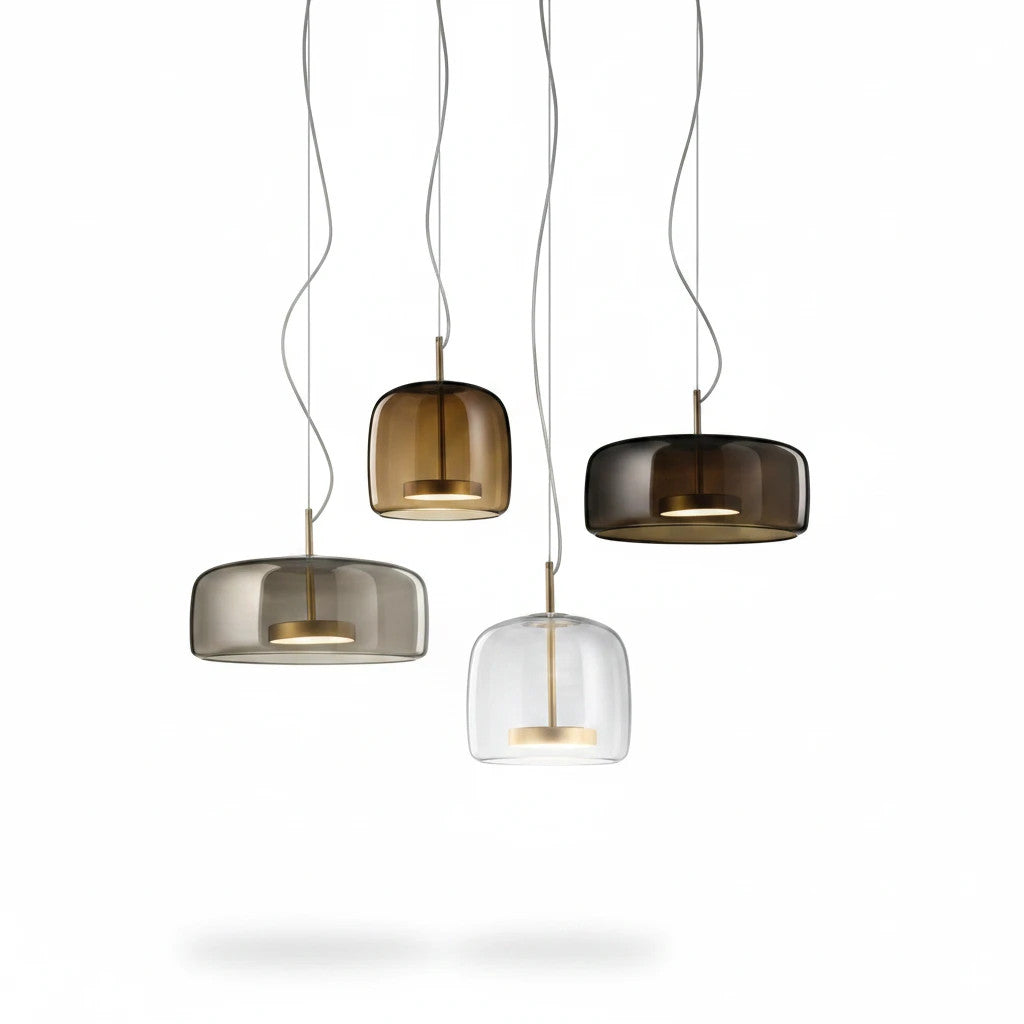 Lysverden bell-shaped pendant lights in smoke, amber, and clear glass with metallic accents hanging in a cluster