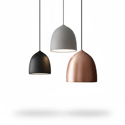 Lysverden bell-shaped metal pendant lights in black, grey, and copper finishes hanging in a minimalist arrangement.