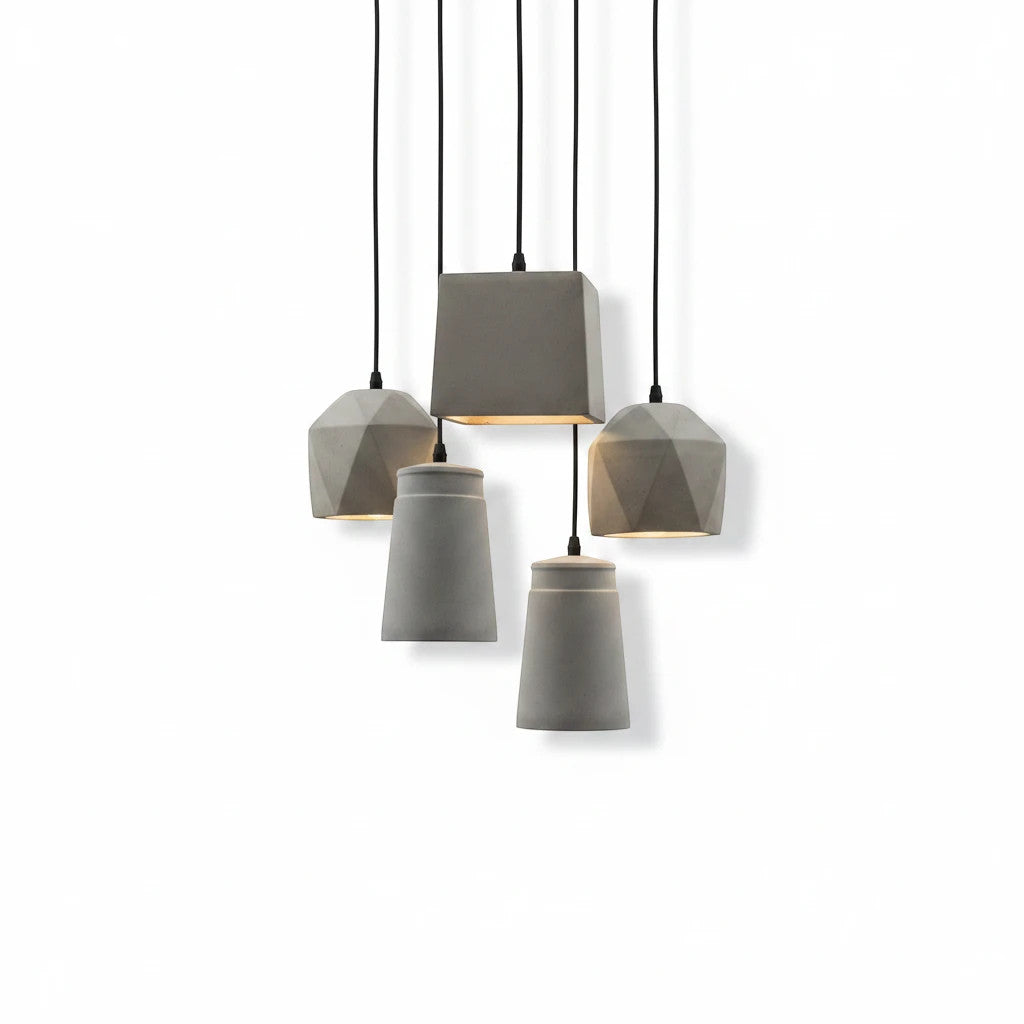 Lysverden BETONG industrial grey cement pendant lights with various geometric shapes hanging in a cluster