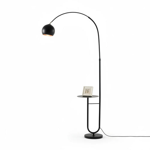 Lysverden sort buegulvlampe med kuppelskjerm i glass og integrert sidebord på stødig fot.