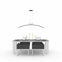 Lysverden black curved LED pendant light hanging over a modern dining table with chairs in a minimalist setting