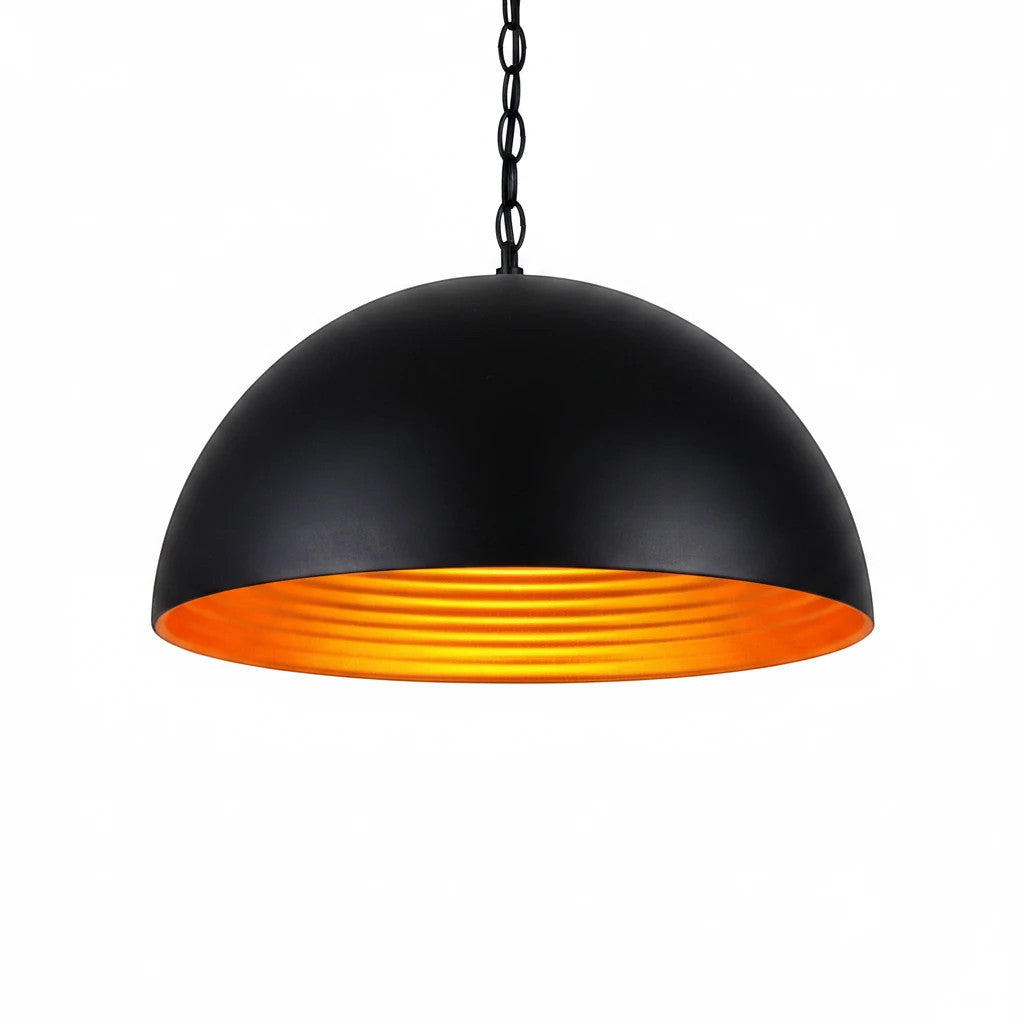 Lysverden matte black dome pendant light with a reflective gold interior for warm, focused dining room lighting.