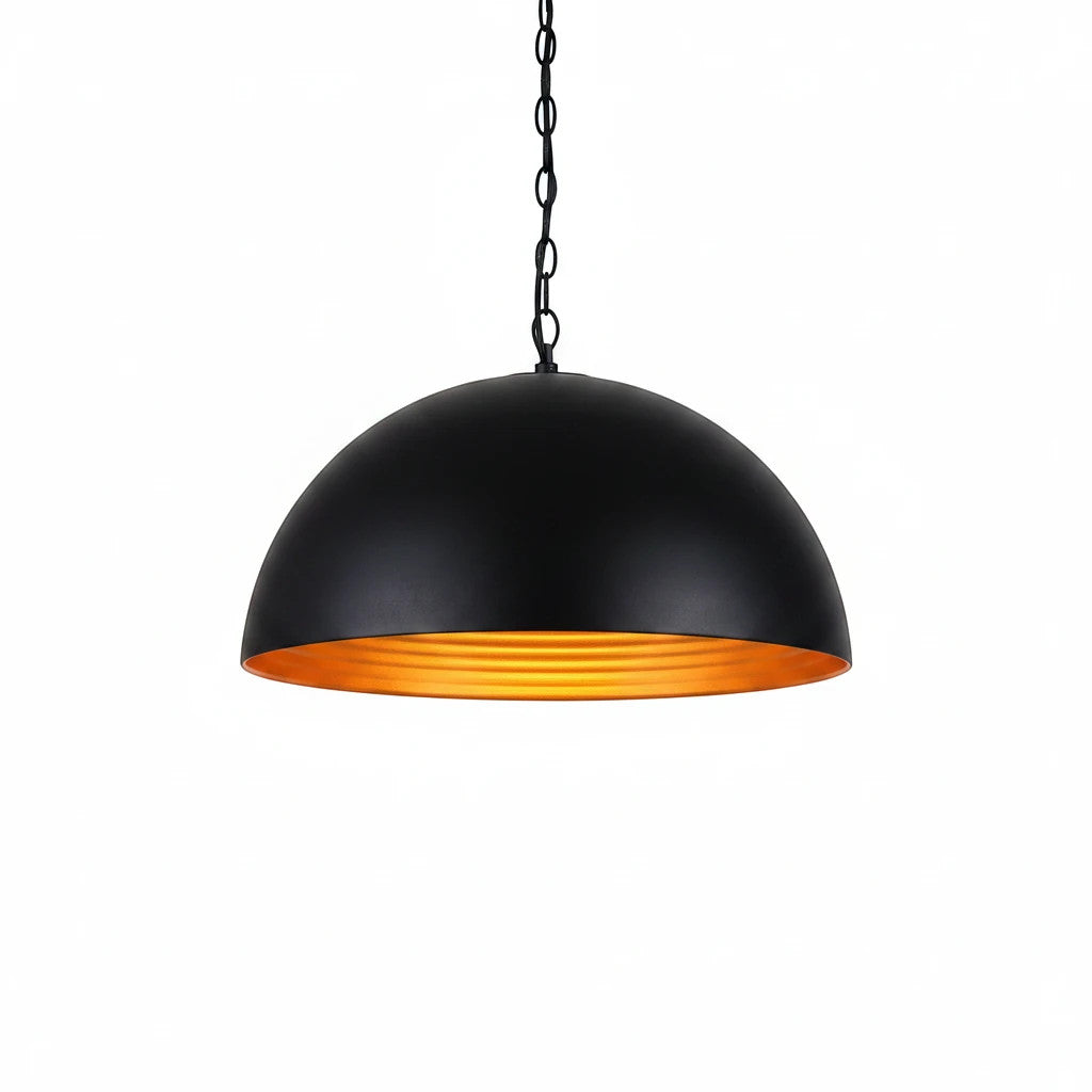 Lysverden matte black metal dome pendant light with a reflective gold interior hanging on a chain