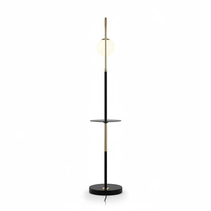 Lysverden floor lamp with a black and gold metal frame, opal glass sphere, and integrated shelf on a white background.