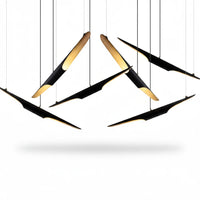 Lysverden modern cluster pendant light with black slanted metal tubes and warm gold interior finish