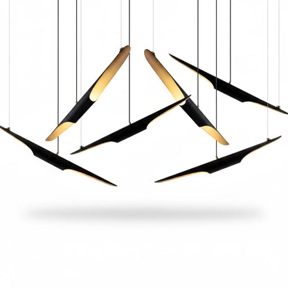 Lysverden modern cluster pendant light with black slanted metal tubes and warm gold interior finish