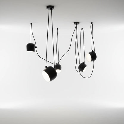 Lysverden black industrial drum pendant cluster with five adjustable metal spotlights hanging from a ceiling mount