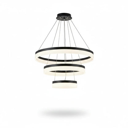Lysverden modern LED chandelier with three concentric black and white rings providing warm, glare-free lighting.