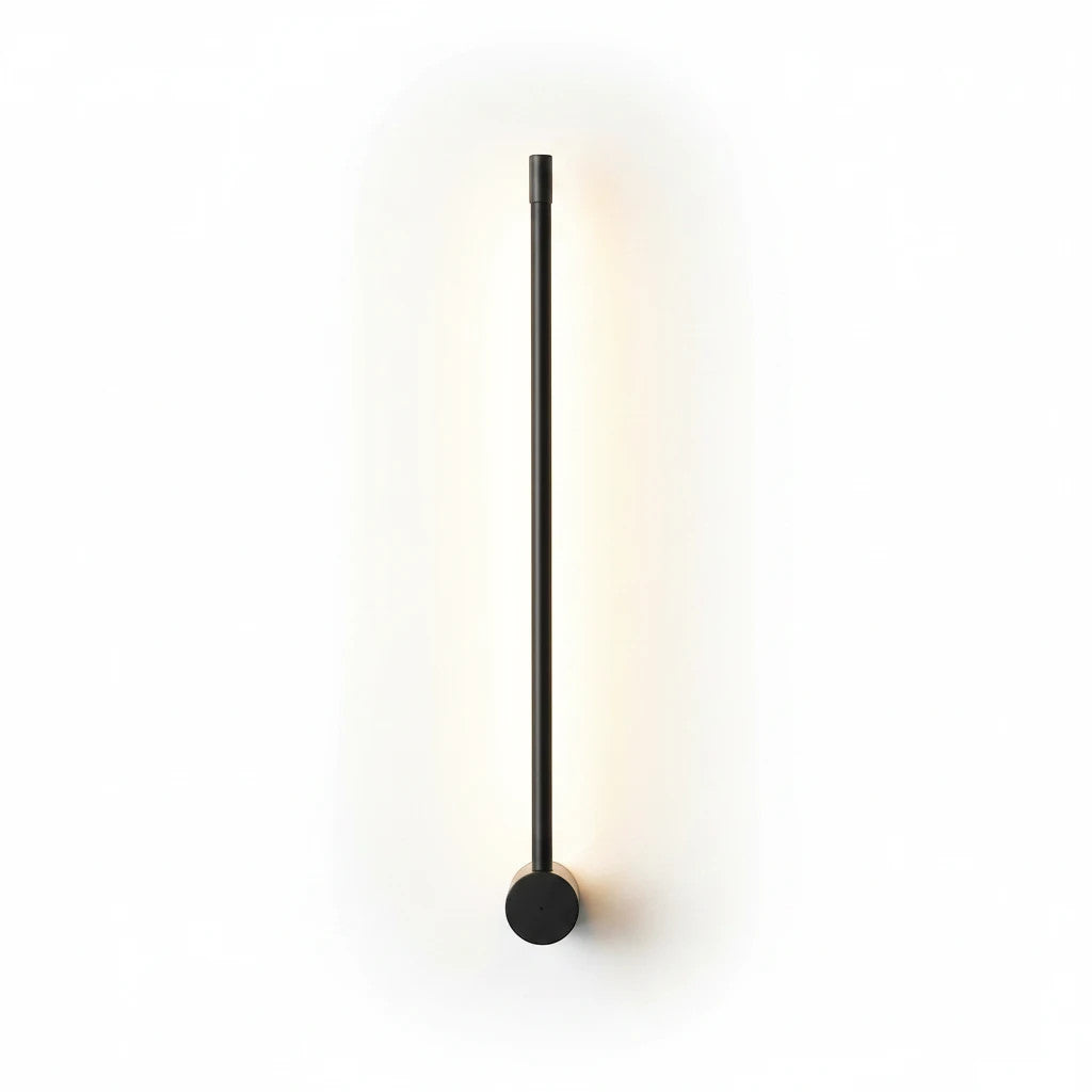 Lysverden minimalist black linear LED wall lamp casting a soft warm glow on a white wall