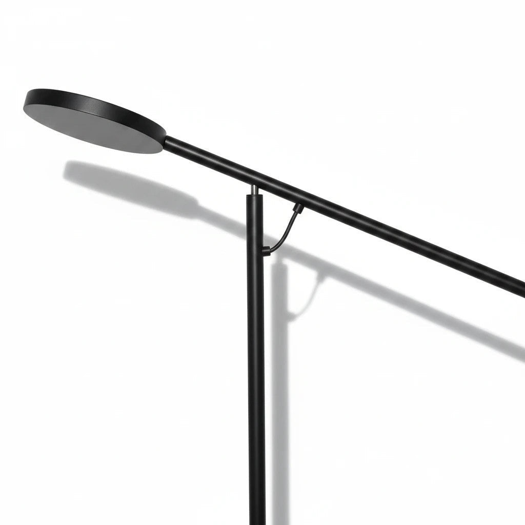 Lysverden minimalist black metal floor lamp with a long cantilever arm for focused lighting in modern interiors.