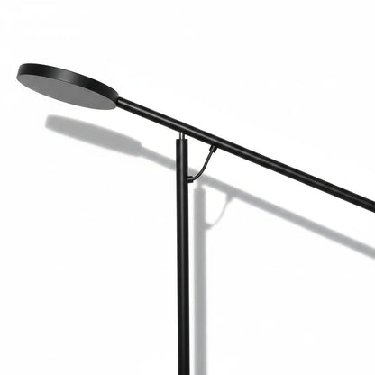 Lysverden minimalist black metal floor lamp with a long cantilever arm for focused lighting in modern interiors.