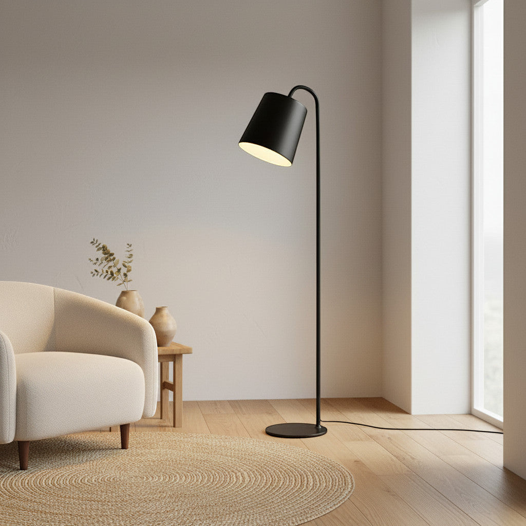 Lysverden black metal floor lamp with cone shade and integrated LED in a minimalist Scandinavian living room
