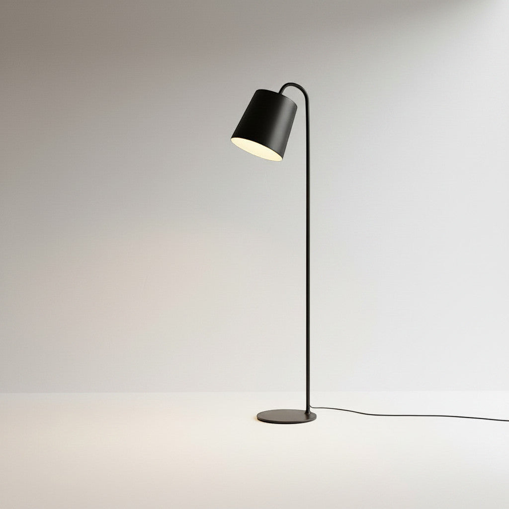 Lysverden black metal floor lamp with a conical shade and integrated LED light, featuring a minimalist Scandinavian design.