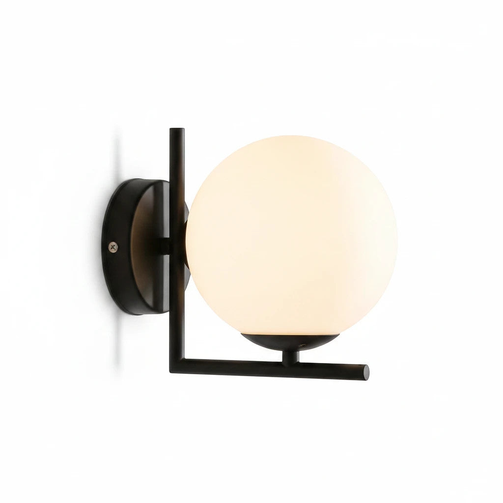 Lysverden modern wall lamp with a round opal glass globe and a minimalist black iron frame for soft ambient lighting.