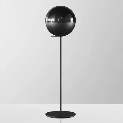 Lysverden floor lamp with a modern black spherical glass shade and slim metal stand for elegant ambient lighting.
