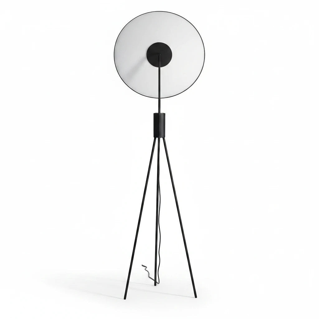 Lysverden minimalist black tripod floor lamp with a circular uplight shade for soft indirect warm LED lighting.