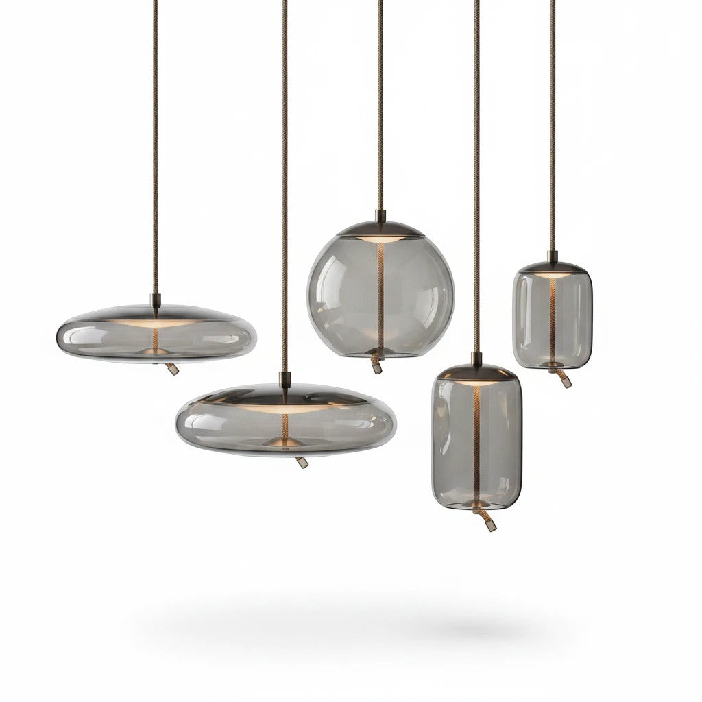 Lysverden BOBLE pendant lights in smoke-colored mouth-blown glass with organic shapes and metallic details.