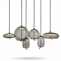 Lysverden BOBLE pendant light cluster with organic, mouth-blown smoke-grey glass shades in various shapes and sizes.