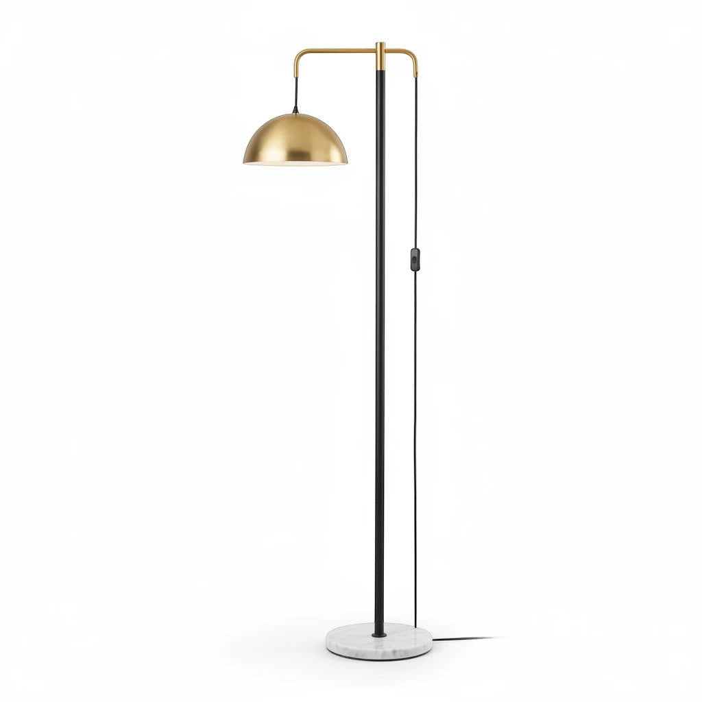 Lysverden floor lamp with a polished brass dome shade, slim black stem, and a round white marble base.