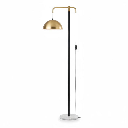 Lysverden floor lamp with a polished brass dome shade, slim black stem, and a round white marble base.