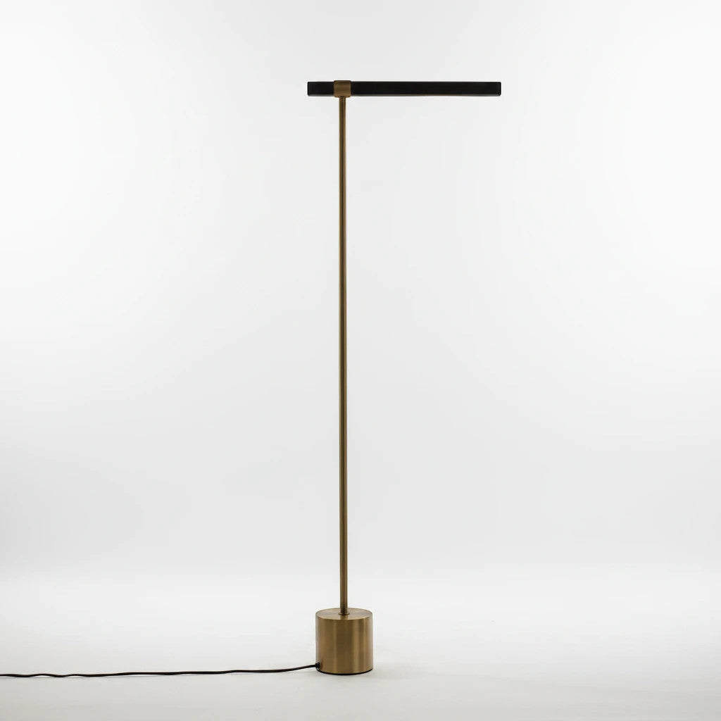 Lysverden minimalist floor lamp with a slim brass stand, cylindrical base, and horizontal black LED light bar.