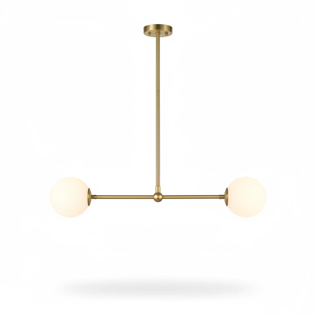 Lysverden linear pendant lamp with a brass finish and two opal white glass globes in a mid-century modern style.