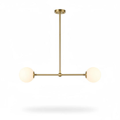 Lysverden linear pendant lamp with a brass finish and two opal white glass globes in a mid-century modern style.