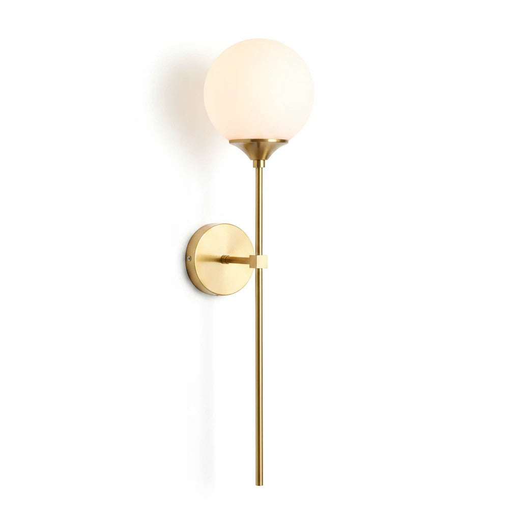 Lysverden elegant wall lamp in brass with a round opal glass globe shade for soft, diffused lighting.