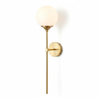 Lysverden elegant wall lamp with a slim brass stem and a round opal glass globe shade for soft, diffused lighting.