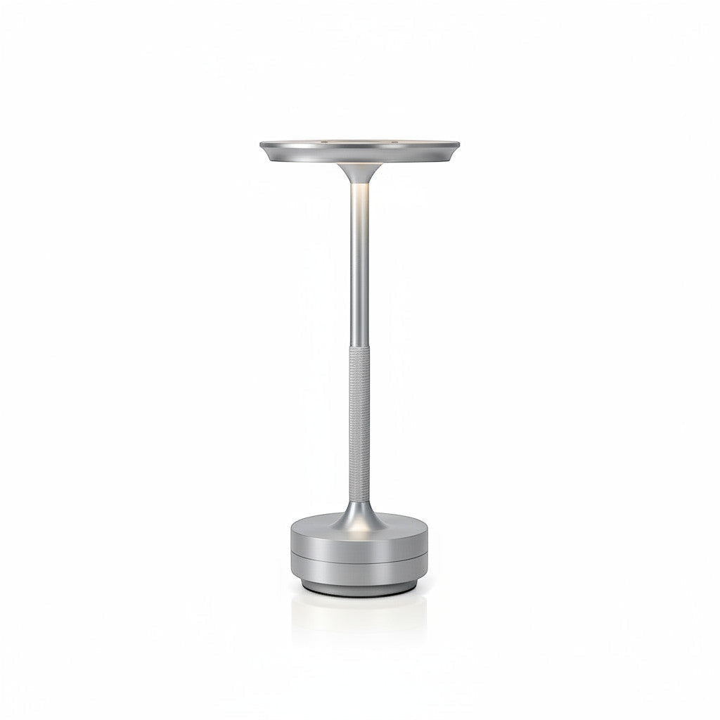 Lysverden cordless table lamp in brushed aluminum with a flat disc top and touch control. Features 3 color temperatures and dimmable light.