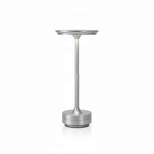 Lysverden cordless table lamp in brushed aluminum with a flat disc top and touch control. Features 3 color temperatures and dimmable light.