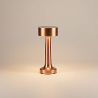 Lysverden brushed aluminum cordless disc-top table lamp with 4 color temperatures and Qi charging.