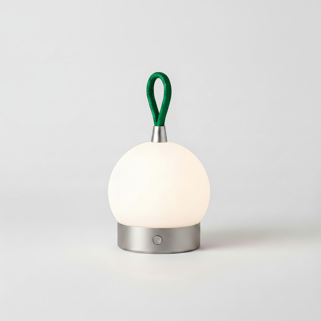 Lysverden ball-shaped camping lantern with green loop handle, touch control, and dimmable light. Aluminum and acrylic.