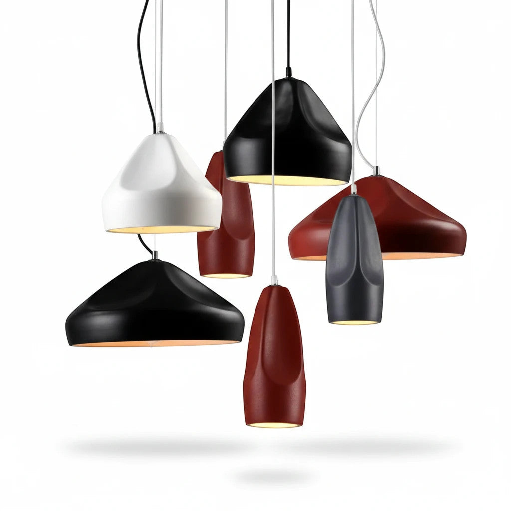 Lysverden ceramic pendant lights in various matte colors and conical shapes hanging together as a modern cluster