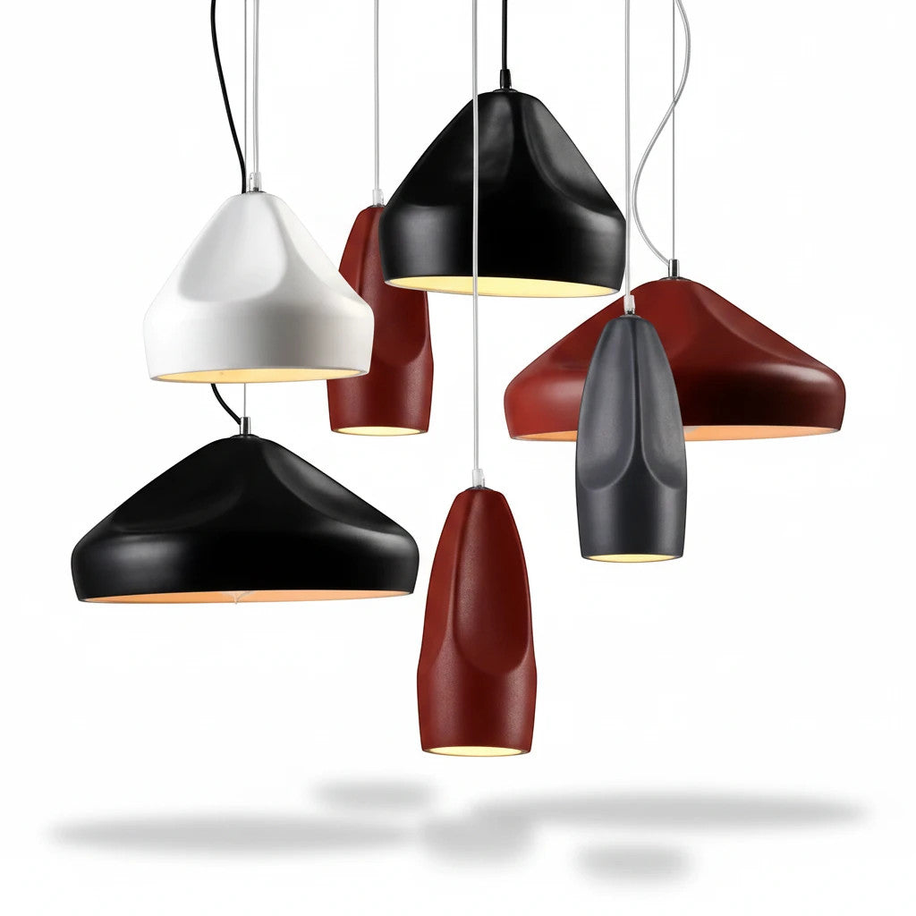 Lysverden ceramic pendant lights in various matte colors and conical shapes hanging in a cluster for modern decor.