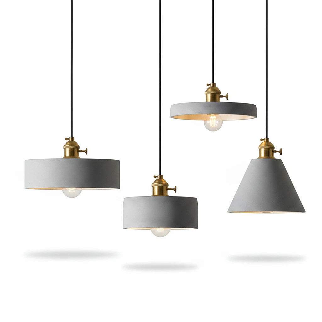 Lysverden set of four industrial concrete pendant lights with brass details hanging against a white background