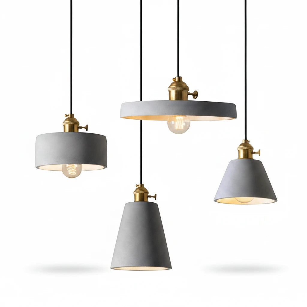 Lysverden industrial concrete pendant lights with brass details in various shapes hanging against a white background