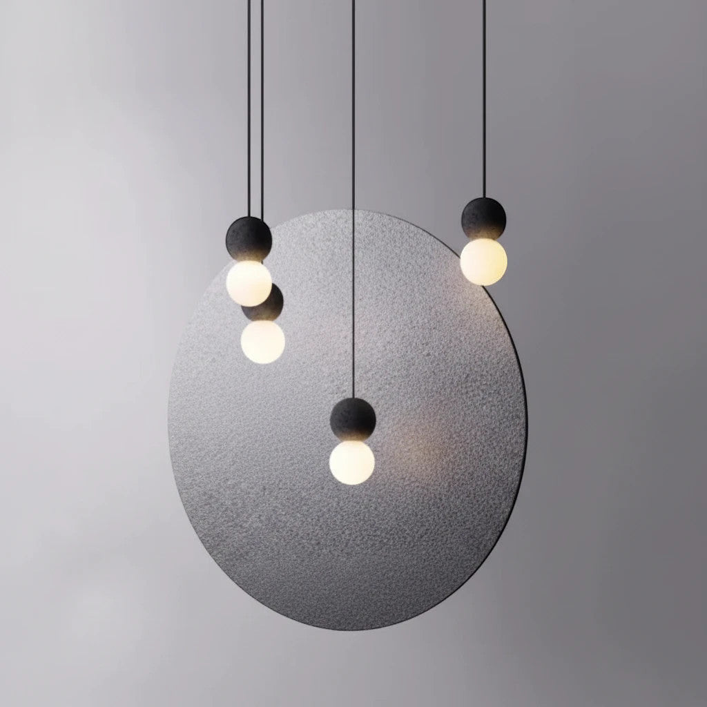 Lysverden minimalist concrete and glass globe pendant lights hanging in a cluster against a grey circular backdrop