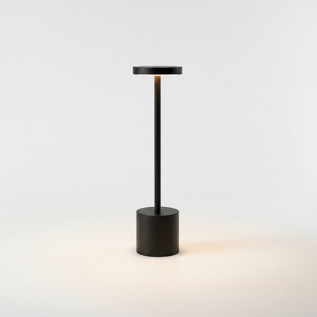Lysverden cordless disc-top table lamp in brushed aluminum with a round base and touch control. Available in 3 sizes.