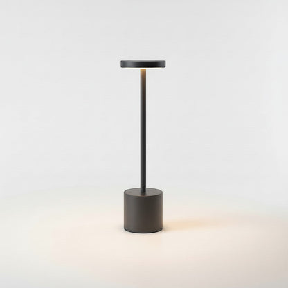 Lysverden dark grey aluminum and PC cordless disc-top table lamp with touch control and 3-level dimming.