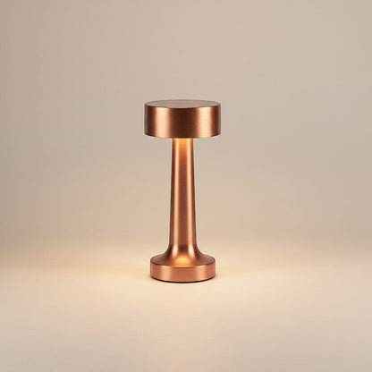 Lysverden cordless table lamp in brushed aluminum with disc top and 4 color temperatures. Features touch control and a silicone base.