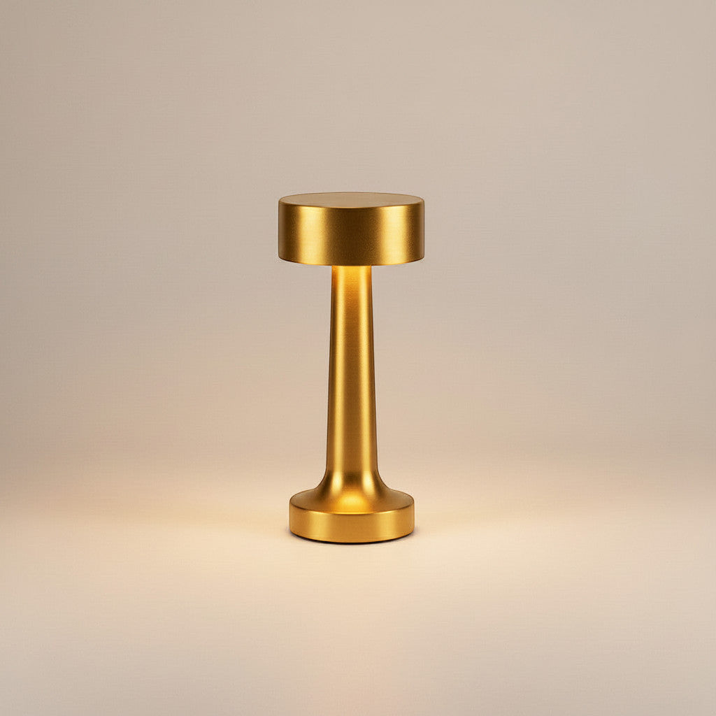 Lysverden cordless table lamp in brushed aluminum with disc top and 4 color temperatures. Features touch control and a silicone base.