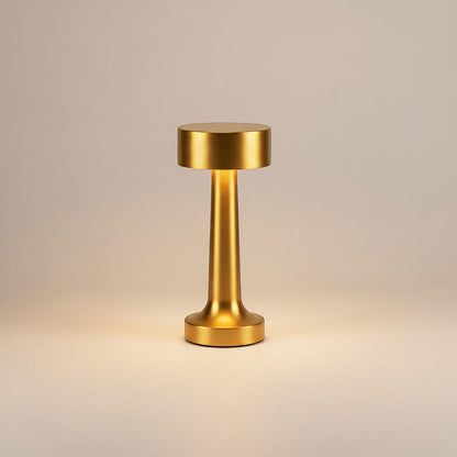 Lysverden cordless table lamp in brushed aluminum with disc top and 4 color temperatures. Features touch control and a silicone base.