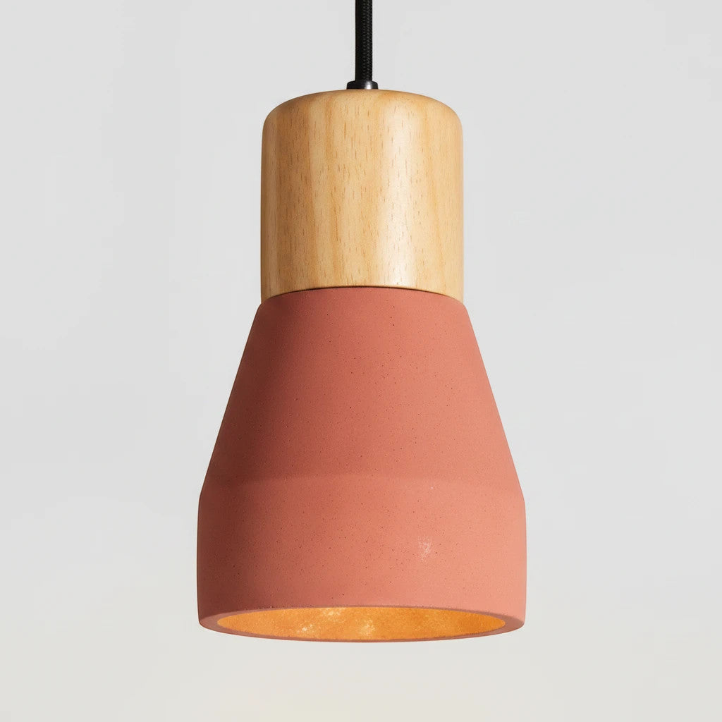 Lysverden small pendant light with a dark red metal dome and a natural wood top in a minimalist Japandi style.